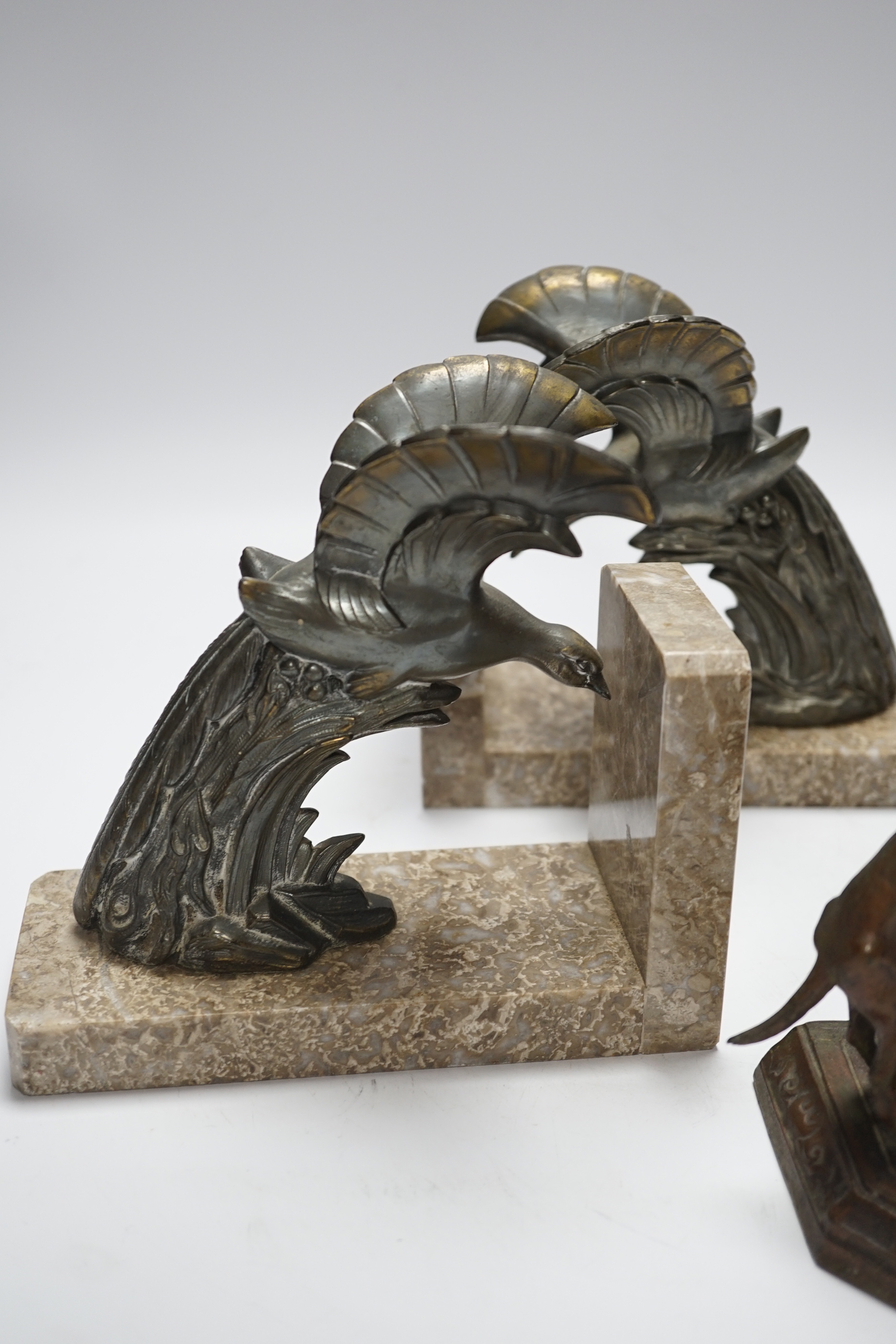 A pair of spelter eagle bookends and a figure with dog, figure 23cm high